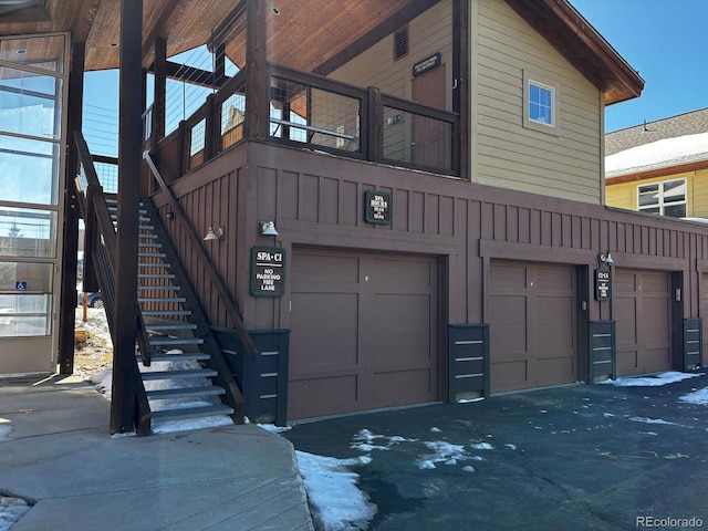 846 Blue River Pkwy Unit C2, Silverthorne, CO 80498 - exterior space with stairs, a garage, and board and batten siding