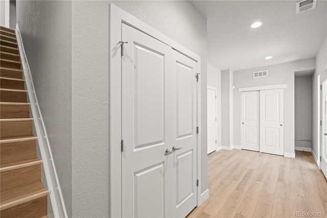 4737 E Iliff Ave, Denver, CO 80222 - hallway featuring light wood-style floors, recessed lighting, and stairs