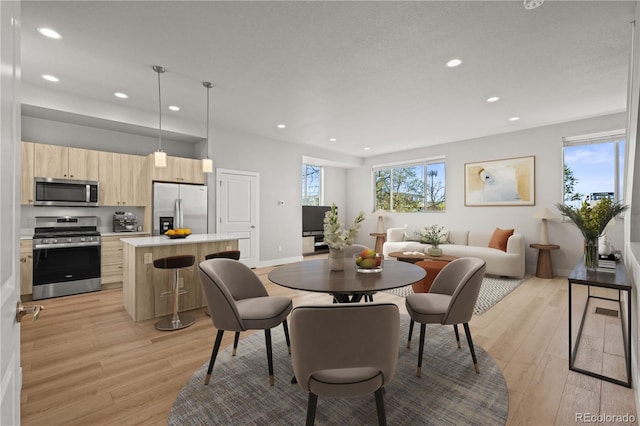 4737 E Iliff Ave, Denver, CO 80222 - dining room with light wood-style floors and recessed lighting