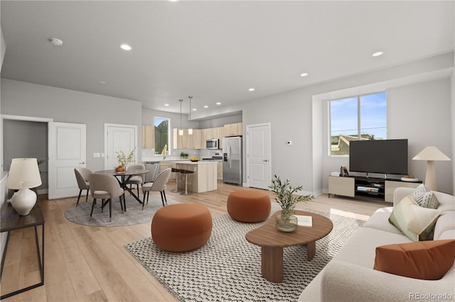 4737 E Iliff Ave, Denver, CO 80222 - living area with light wood-style flooring and recessed lighting