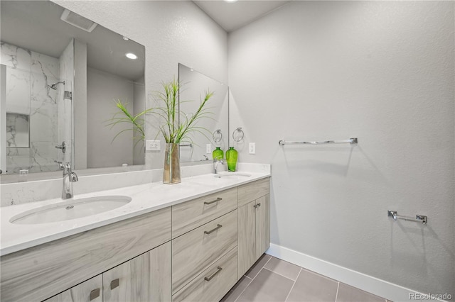 4737 E Iliff Ave, Denver, CO 80222 - bathroom with double vanity, a marble finish shower, and tile patterned floors