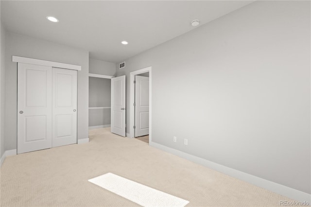 4737 E Iliff Ave, Denver, CO 80222 - unfurnished bedroom featuring carpet flooring, recessed lighting, and a closet