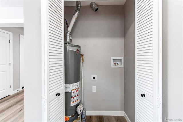 utility room featuring water heater