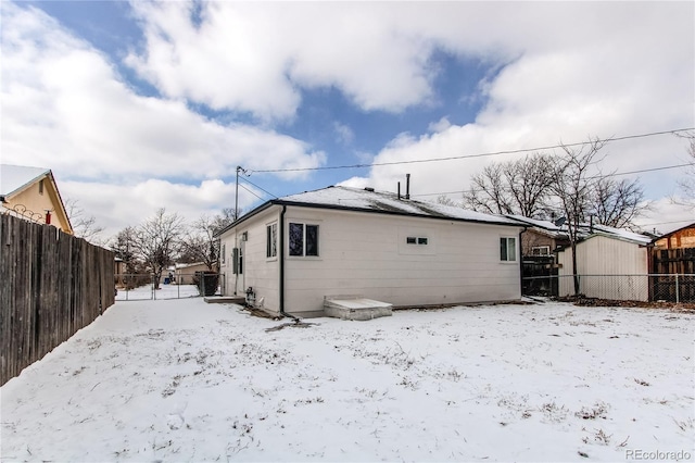 view of snow covered house