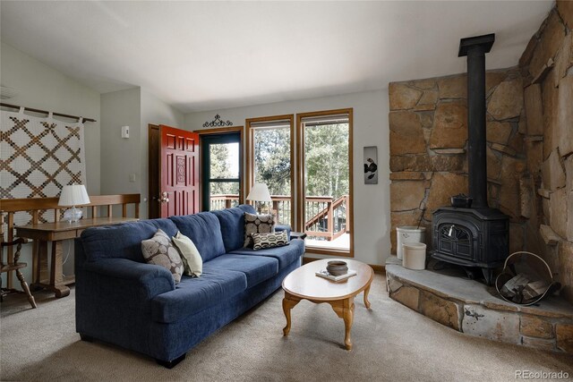 29101 Drexel Spur, Evergreen, CO 80439 - living room with a wood stove, carpet flooring, and lofted ceiling