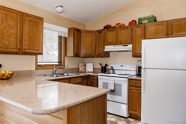29101 Drexel Spur, Evergreen, CO 80439 - kitchen with white appliances, under cabinet range hood, vaulted ceiling, a peninsula, and brown cabinets