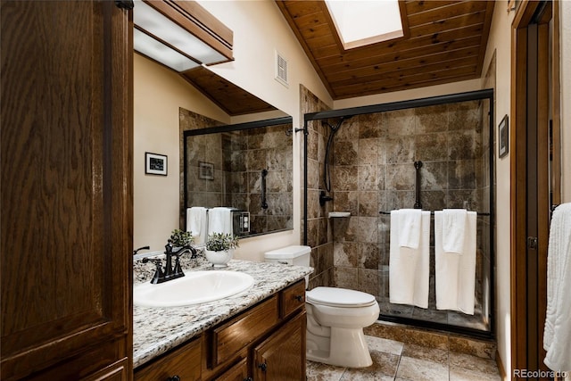 29101 Drexel Spur, Evergreen, CO 80439 - bathroom with vanity, a tile shower, a skylight, and lofted ceiling
