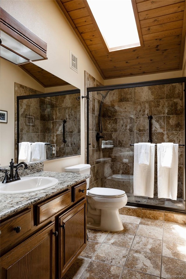 29101 Drexel Spur, Evergreen, CO 80439 - bathroom featuring vaulted ceiling, vanity, a tile shower, wooden ceiling, and a skylight