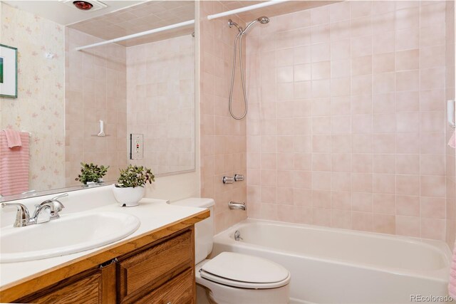 29101 Drexel Spur, Evergreen, CO 80439 - bathroom featuring  shower combination, vanity, and wallpapered walls