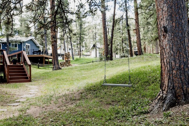 29101 Drexel Spur, Evergreen, CO 80439 - view of yard featuring a deck and stairway