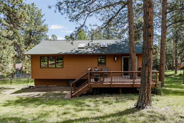 29101 Drexel Spur, Evergreen, CO 80439 - back of house with a deck and roof with shingles