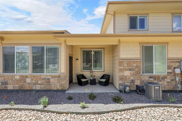 12258 Hazel Spruce Ct, Parker, CO 80134 - property entrance featuring stone siding and cooling unit