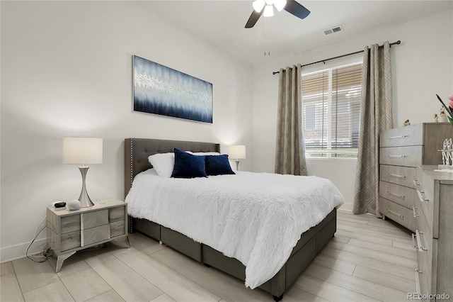 12258 Hazel Spruce Ct, Parker, CO 80134 - bedroom with baseboards, light wood-type flooring, and a ceiling fan