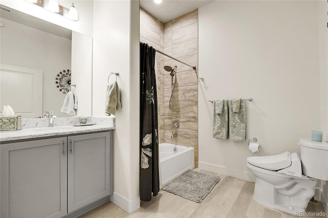 12258 Hazel Spruce Ct, Parker, CO 80134 - bathroom with toilet, shower / bath combination with curtain, baseboards, vanity, and wood finished floors
