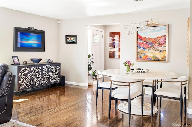 dining area with hardwood / wood-style floors