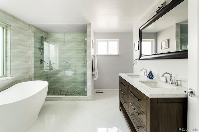 bathroom with vanity and independent shower and bath