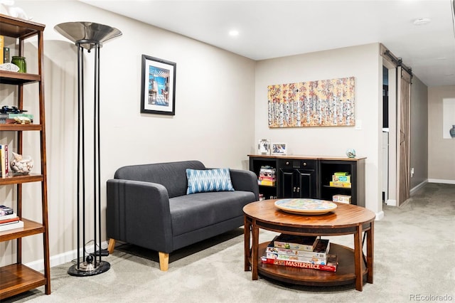 carpeted living room featuring a barn door