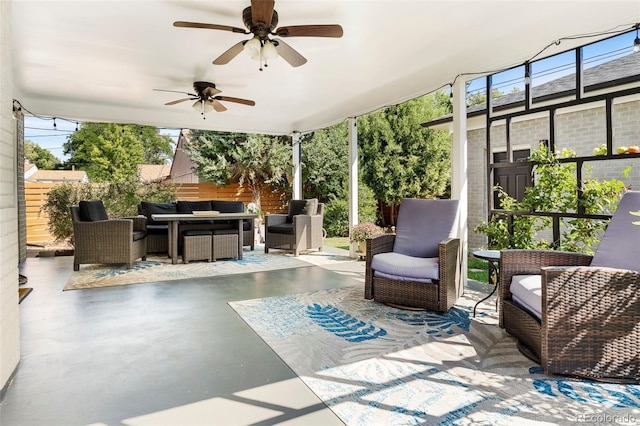 view of patio with ceiling fan and an outdoor living space