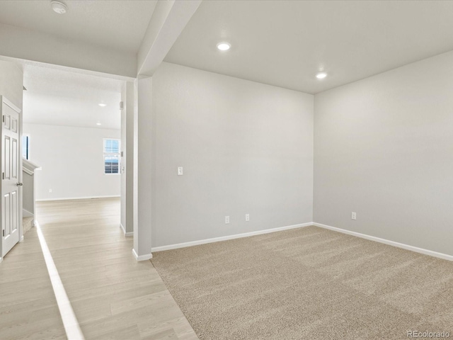 spare room with light hardwood / wood-style floors