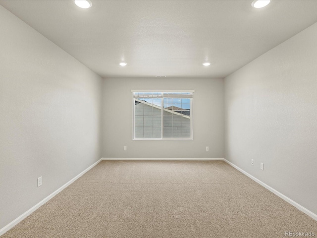 unfurnished room with carpet floors