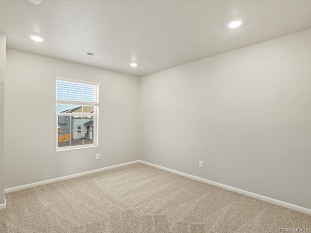 unfurnished room featuring carpet flooring