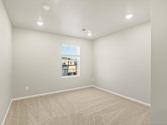 unfurnished room with carpet floors