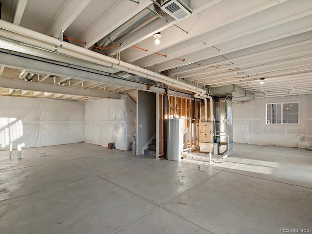 basement with heating unit and water heater