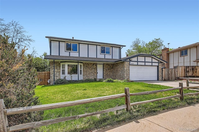 tudor-style house featuring an attached garage, stone siding, and driveway