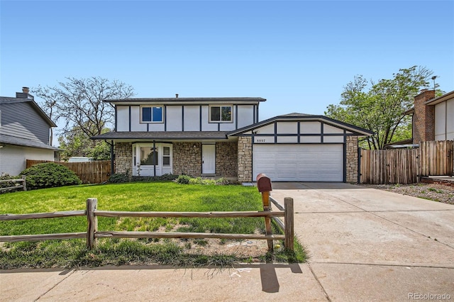8897 Wagner Ln, Westminster, CO 80031 - tudor-style house with stone siding, a garage, concrete driveway, and a porch