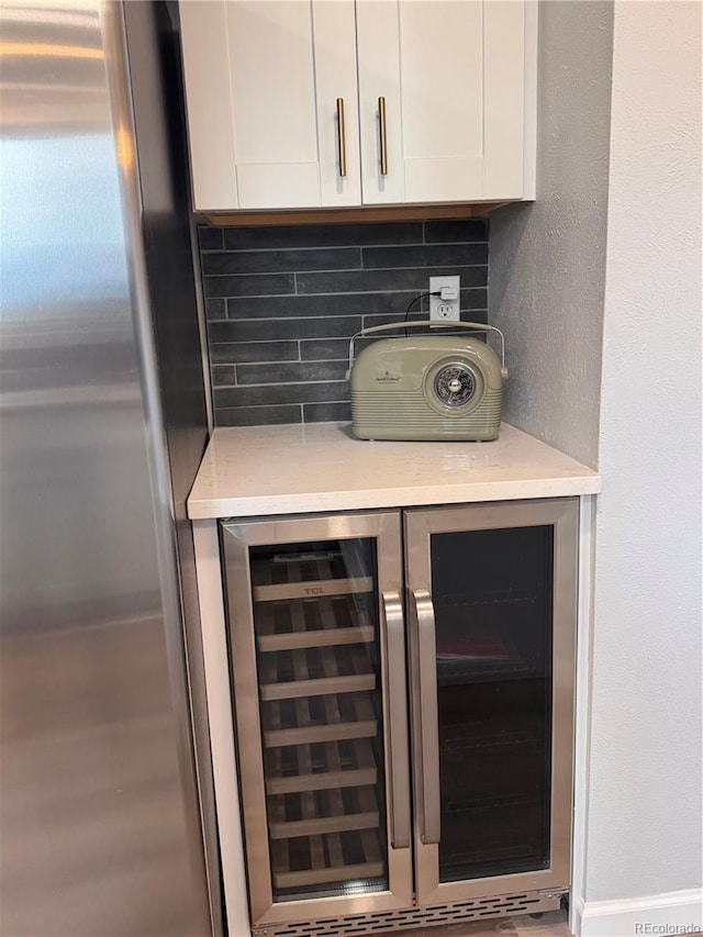 8897 Wagner Ln, Westminster, CO 80031 - detailed view of stainless steel refrigerator, beverage cooler, and backsplash