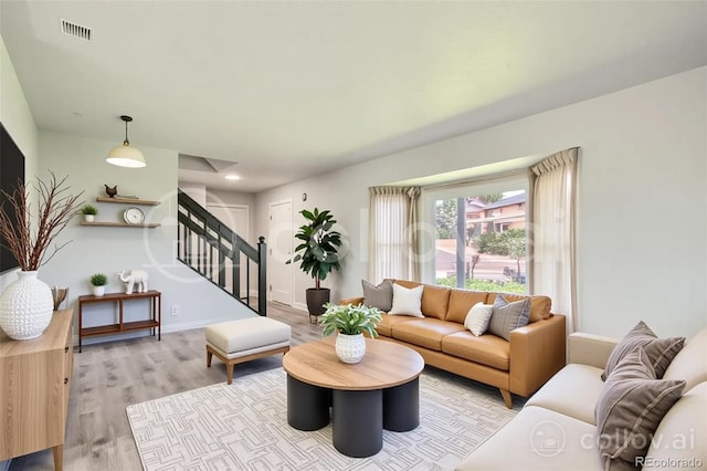 8897 Wagner Ln, Westminster, CO 80031 - living room featuring stairway and wood finished floors
