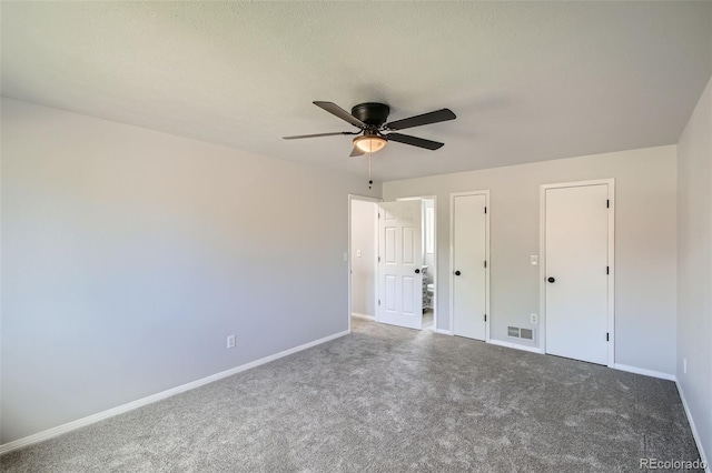 8897 Wagner Ln, Westminster, CO 80031 - unfurnished bedroom with carpet flooring, ceiling fan, and two closets