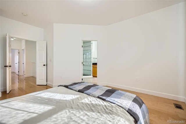 bedroom featuring light hardwood / wood-style floors