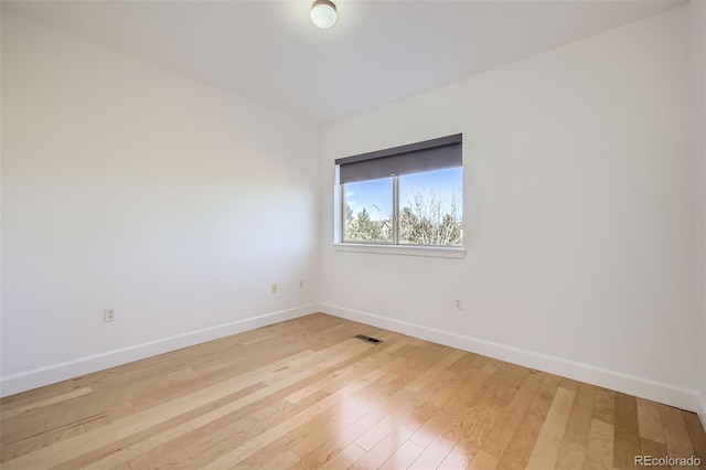 unfurnished room featuring light wood-type flooring