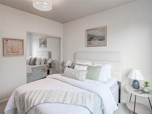 bedroom featuring carpet floors, a closet, and baseboards