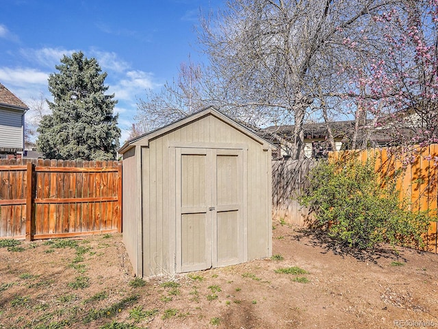 view of shed featuring a fenced backyard