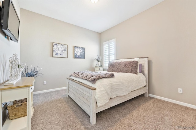 carpeted bedroom with baseboards