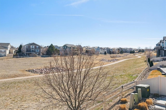 view of yard featuring a residential view and fence