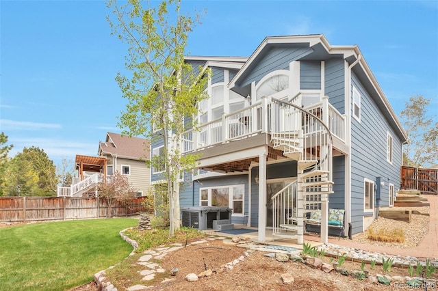 9371 Desert Willow Trl, Highlands Ranch, CO 80129 - back of property featuring stairway, a patio, and a deck