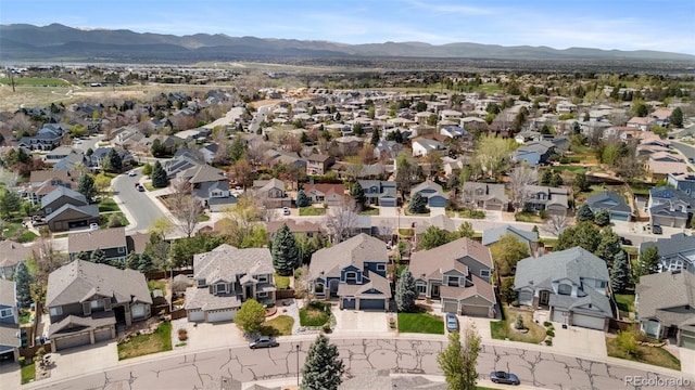 9371 Desert Willow Trl, Highlands Ranch, CO 80129 - aerial view of property and surrounding area featuring mountains and nearby suburban area