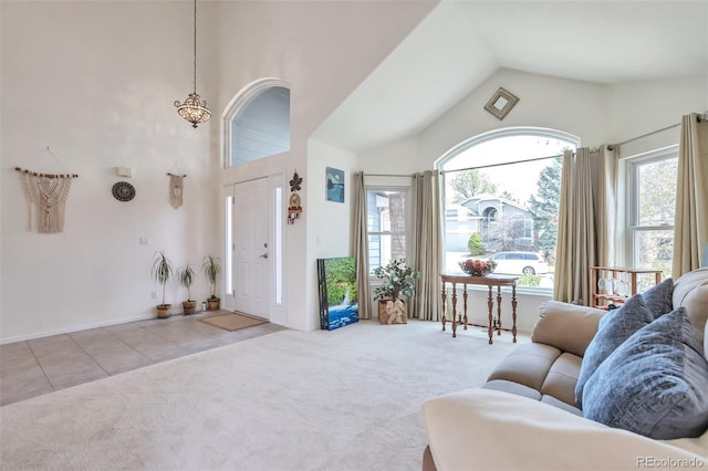 9371 Desert Willow Trl, Highlands Ranch, CO 80129 - living area featuring carpet flooring, tile patterned flooring, and high vaulted ceiling