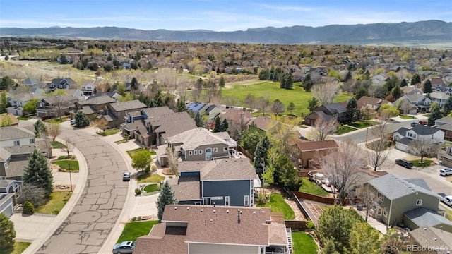 9371 Desert Willow Trl, Highlands Ranch, CO 80129 - aerial view of property and surrounding area featuring nearby suburban area and a mountainous background