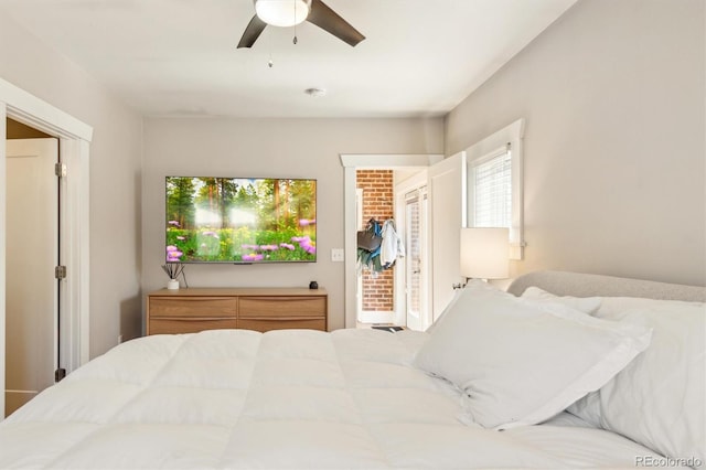 bedroom with a closet, a spacious closet, and a ceiling fan