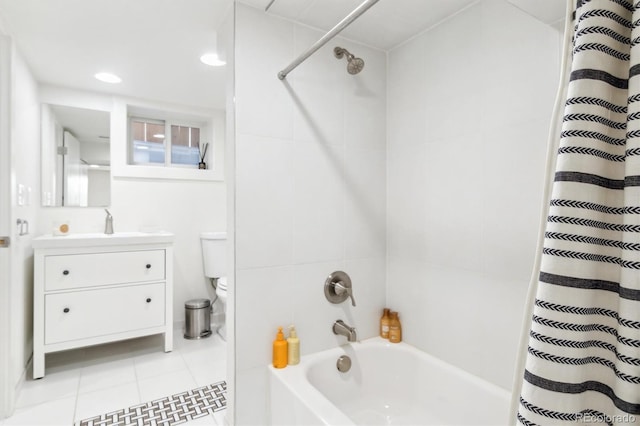 bathroom featuring shower / tub combo, vanity, toilet, and tile patterned floors