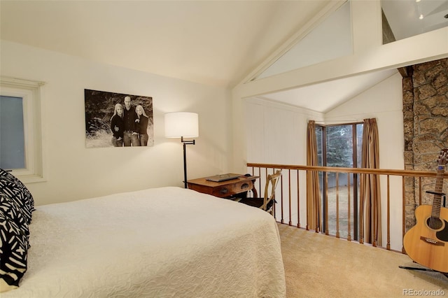 bedroom featuring lofted ceiling and carpet flooring