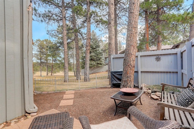 view of patio featuring fence