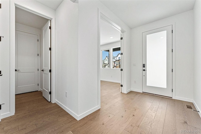 foyer entrance with light hardwood / wood-style flooring