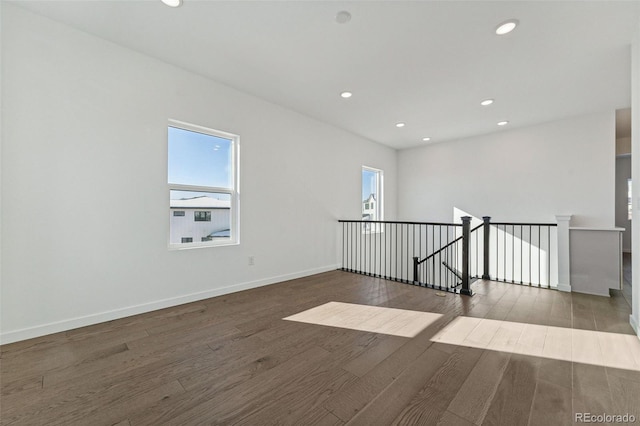 empty room featuring dark wood-type flooring