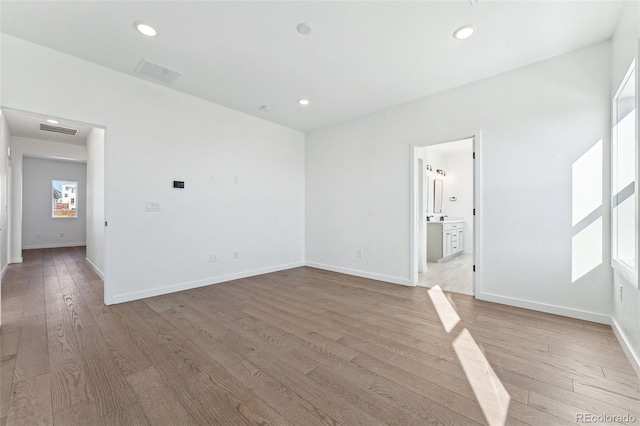 spare room featuring light wood-type flooring