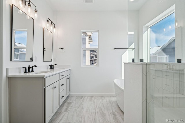 bathroom with a bathing tub and vanity